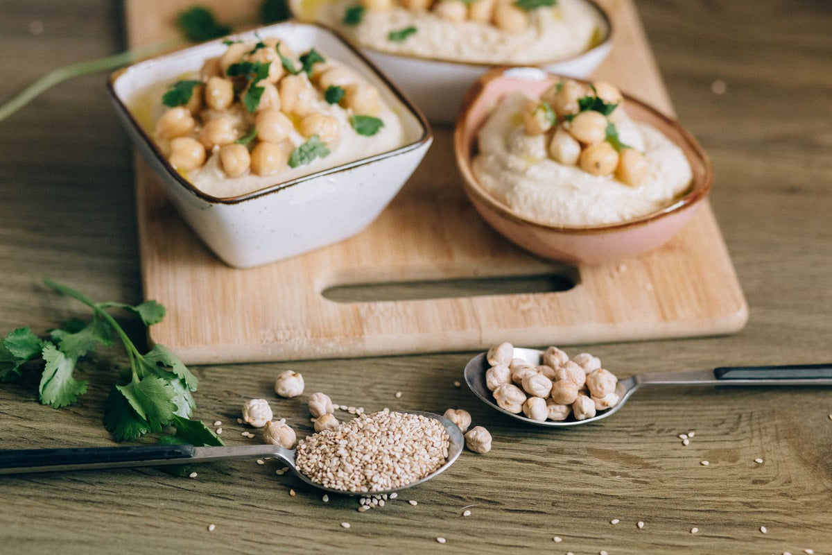 Creamy hummus with chickpeas — serving inspiration for black seed oil recipes