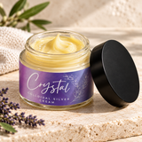 Open jar of pale yellow cream with a purple Crystal Colloidal Silver Cream label and a black lid, with linen and leaves behind it.
