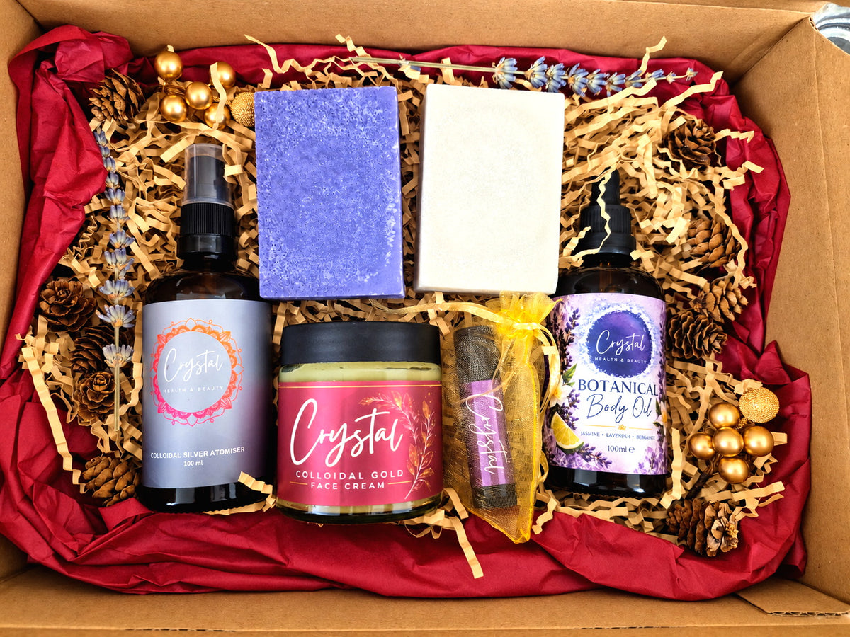 Christmas skincare gift box with lavender and plain silver soaps, silver atomiser, gold face cream, mango lip balm and botanical body oil.