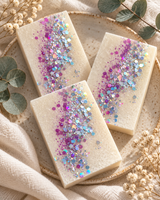 Three handmade Frosted Rhubarb and Rose colloidal silver soap bars with pink and iridescent glitter
