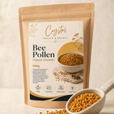 Organic bee pollen granules 500g kraft pouch beside a ceramic spoon of granules